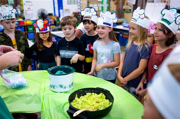 Students learning about Green Eggs and Ham and how to make them. 